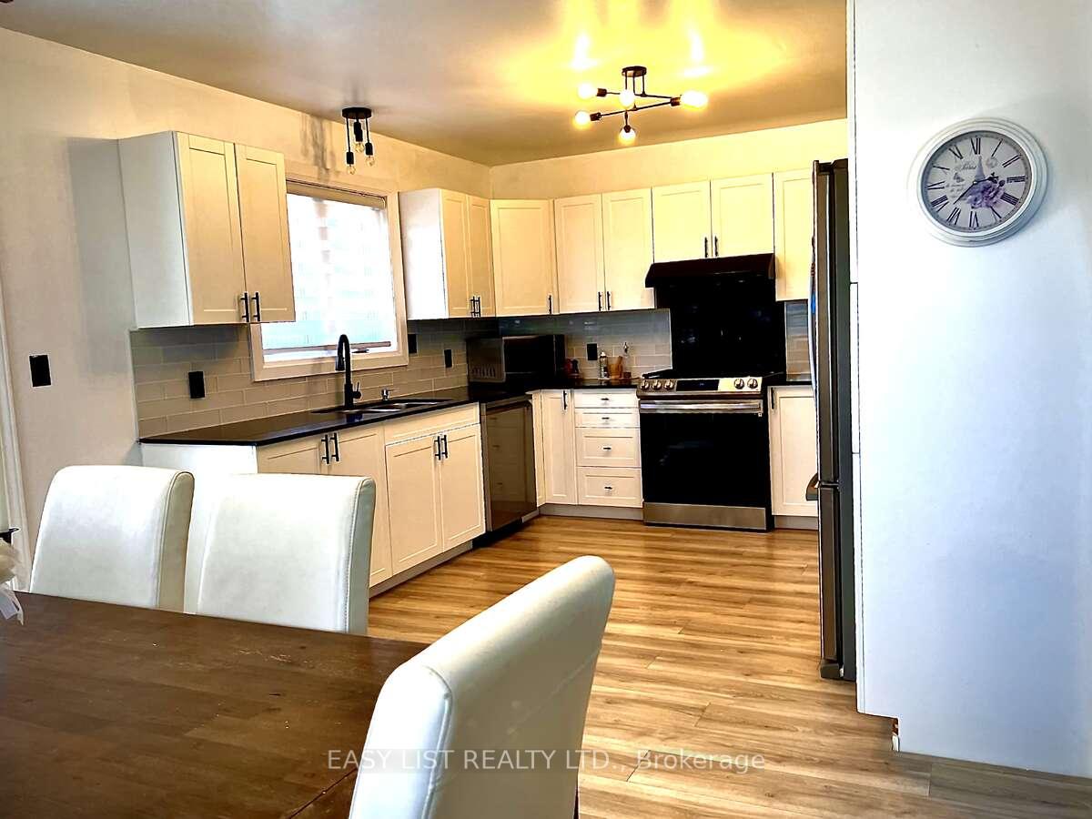 Photo 24 of 35 Algonquin Road, Cochrane — HOMEH