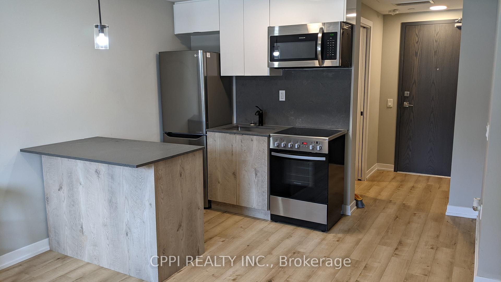 Photo 3 of Unit 204, 70 King Street E, Oshawa, Central — HOMEH