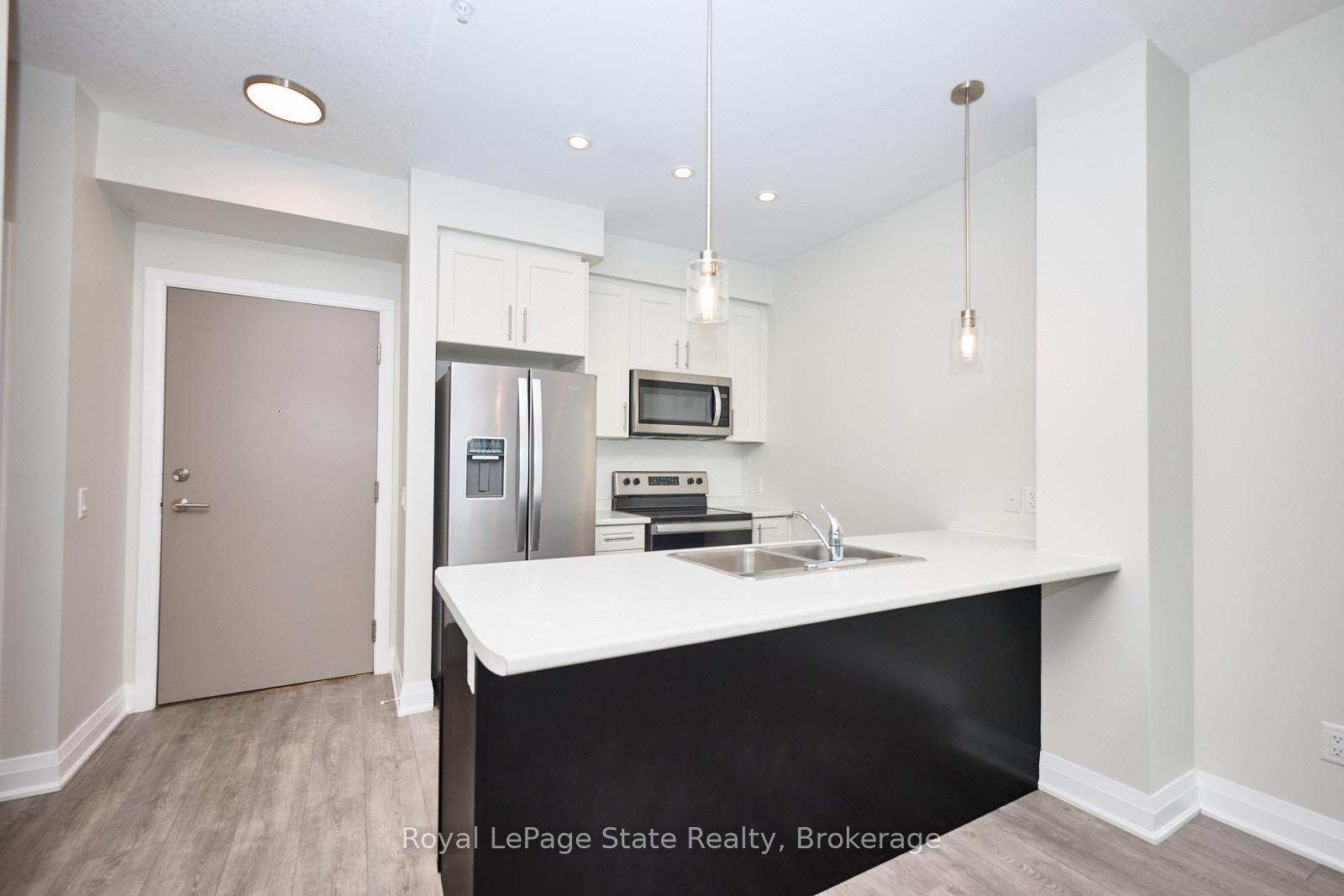 Photo 4 of Unit 301, 16 Concord Place, Grimsby, Grimsby Beach — HOMEH