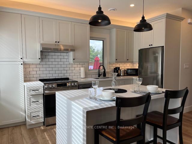 Photo 1 of Unit 2, 9703 Dundas Street E, Erin, Rural Erin — HOMEH