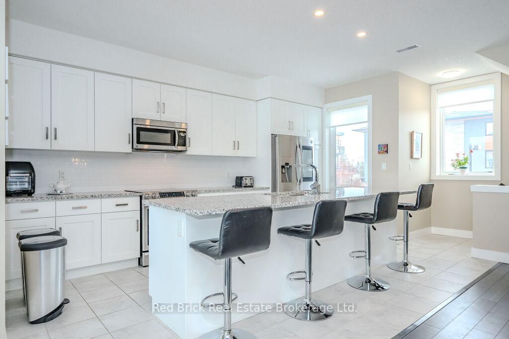 Photo 4 of Unit 20, 32 Arkell Road, Guelph, Kortright East — HOMEH