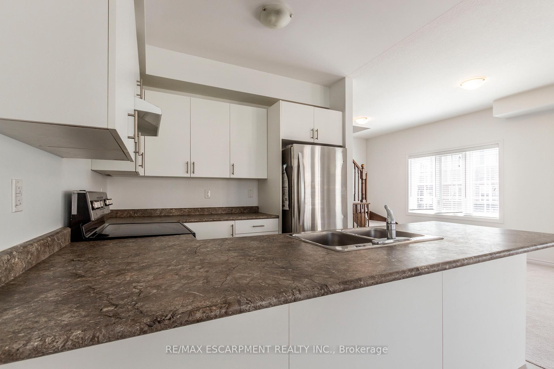 Photo 15 of Unit 27, 88 Decorso Drive, Guelph, Kortright East — HOMEH