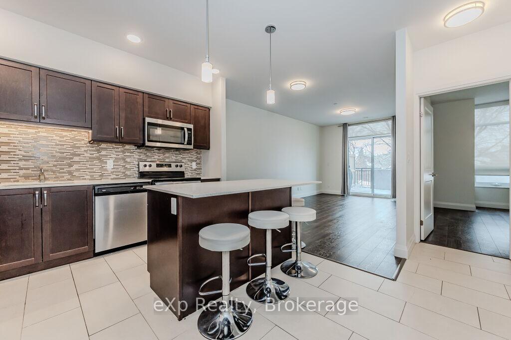 Photo 5 of Unit 107, 399 Queen Street S, Kitchener — HOMEH