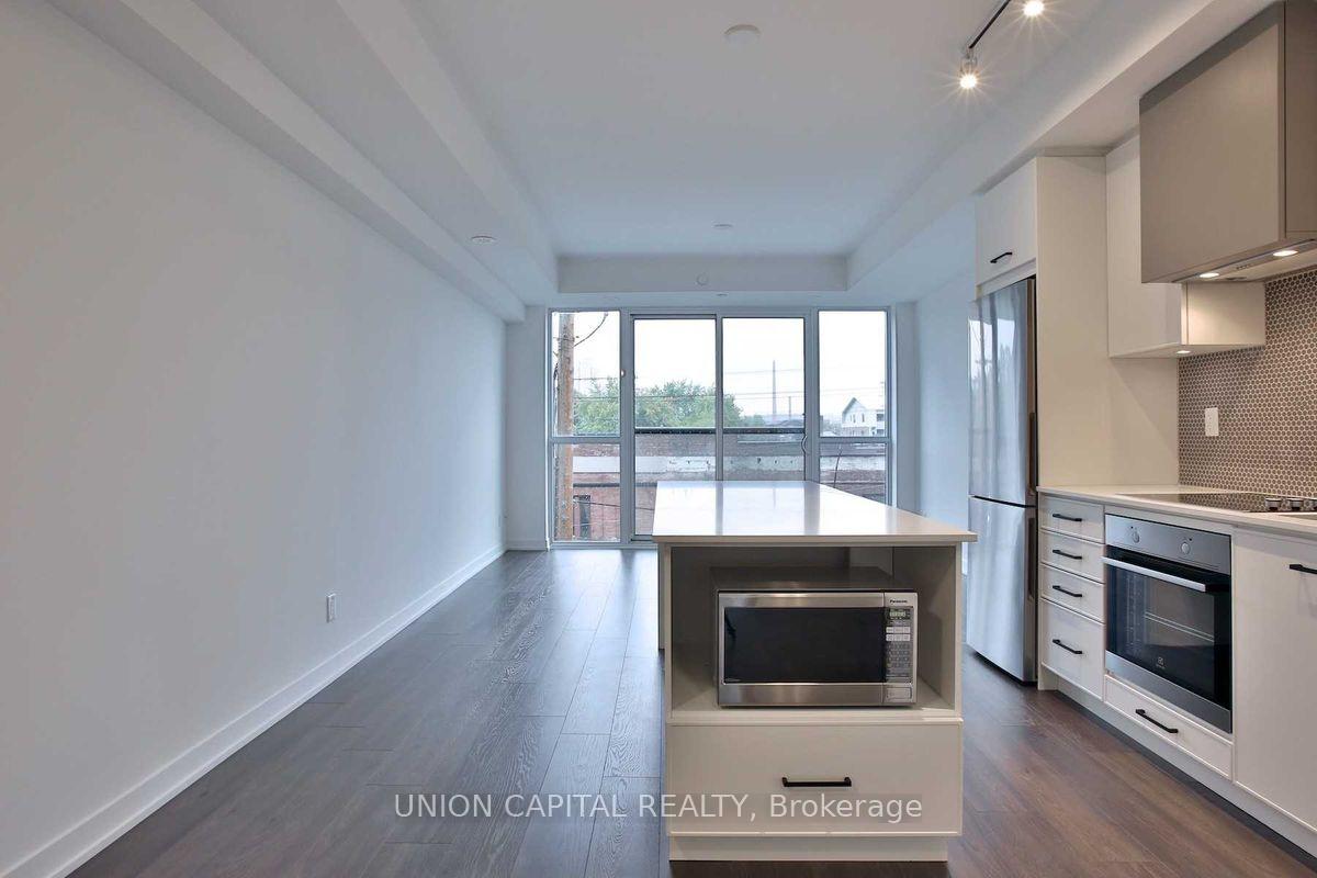 Photo 5 of Unit 304, 899 Queen Street E, Toronto, South Riverdale — HOMEH
