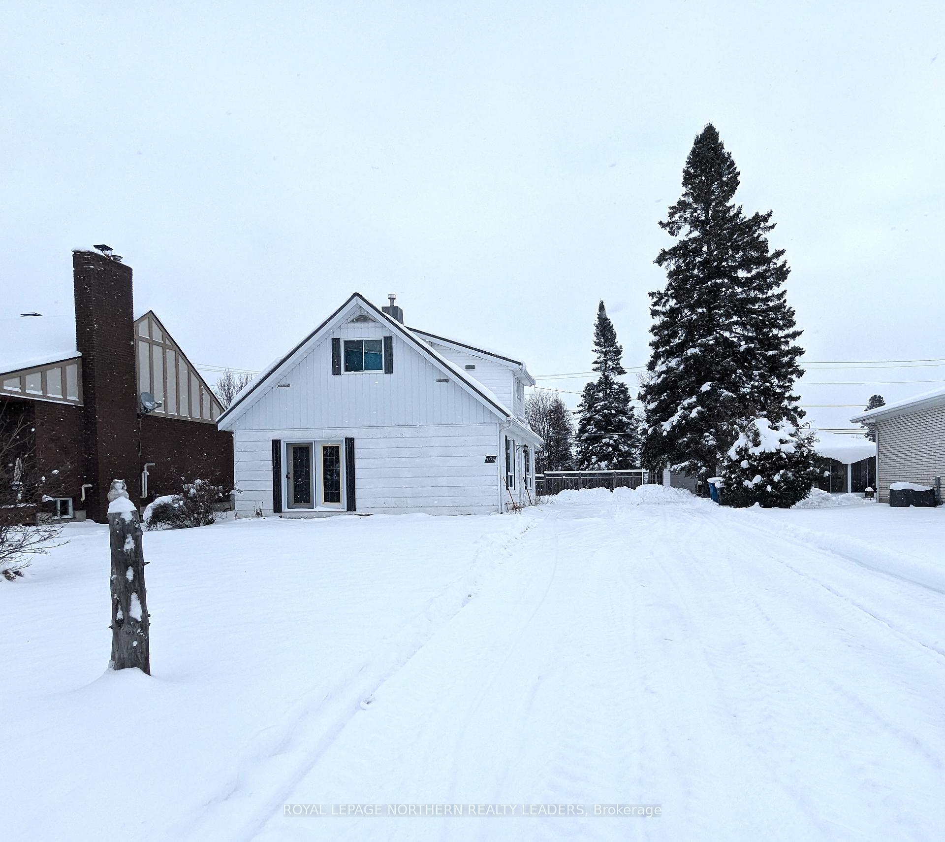 Photo 1 of 404 Eighth Avenue, Cochrane — HOMEH