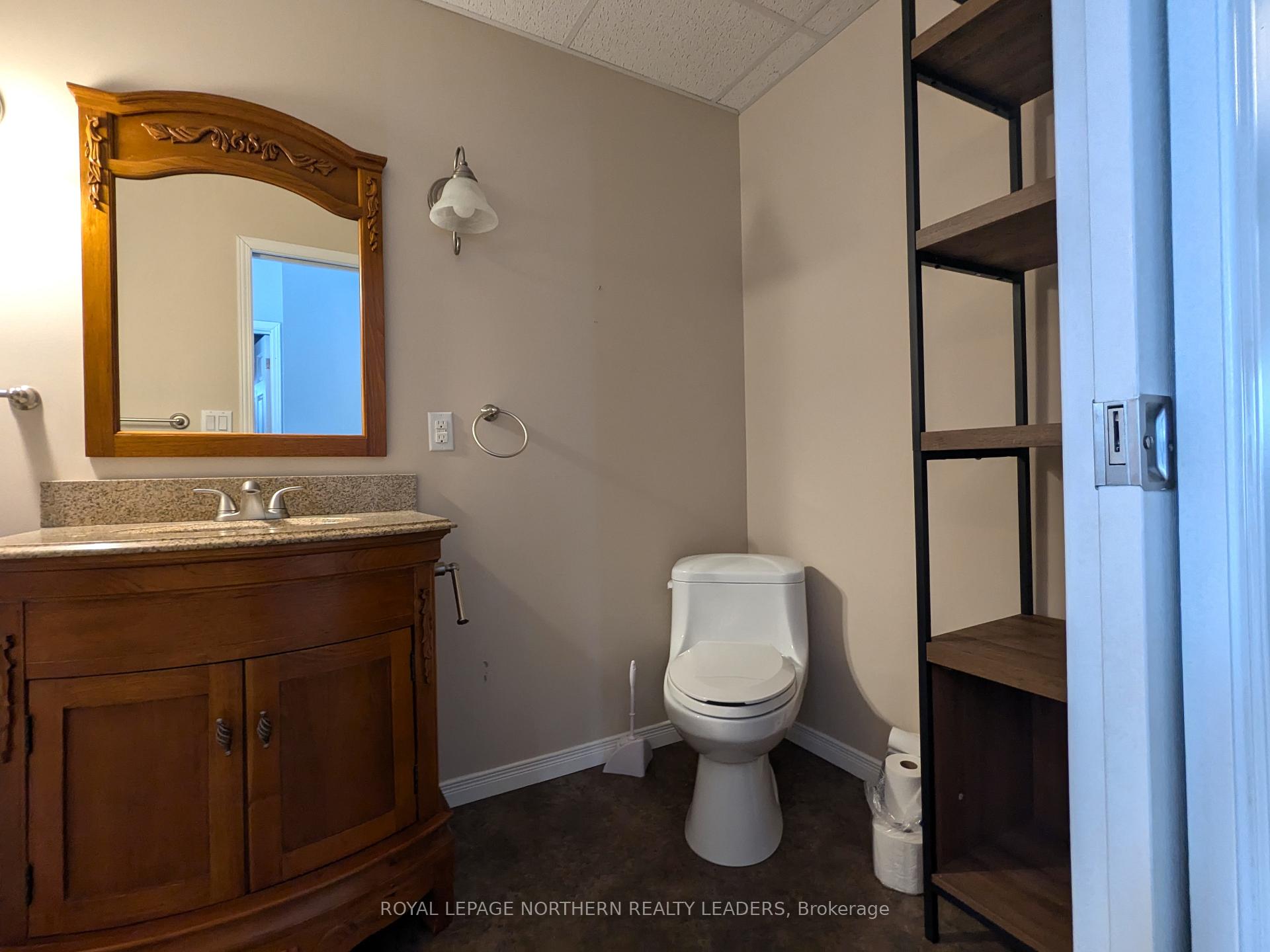 Photo 10 of 404 Eighth Avenue, Cochrane — HOMEH