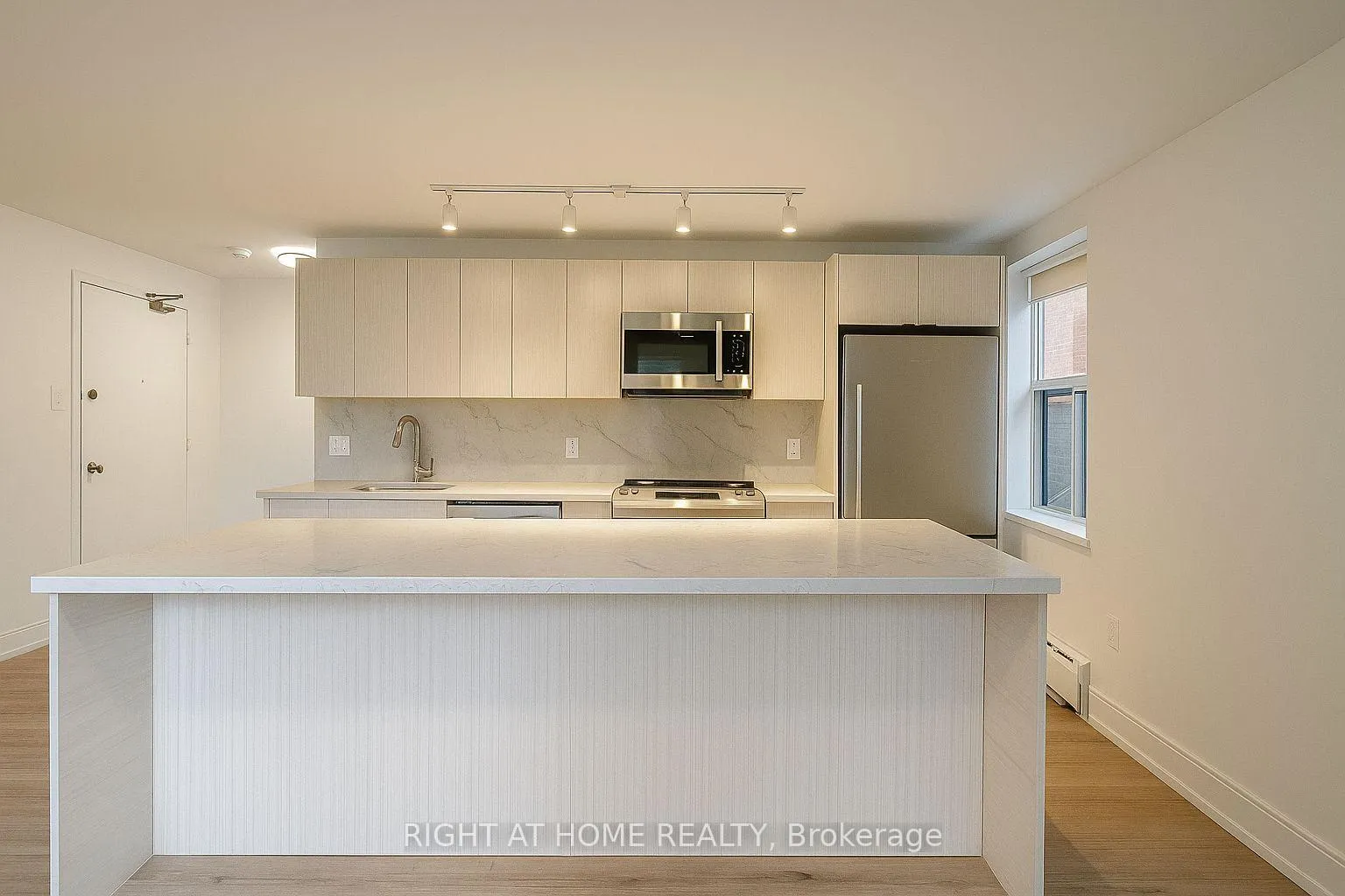Photo 3 of Unit 1, 111 Cosburn Avenue, Toronto, Danforth Village-East York — HOMEH