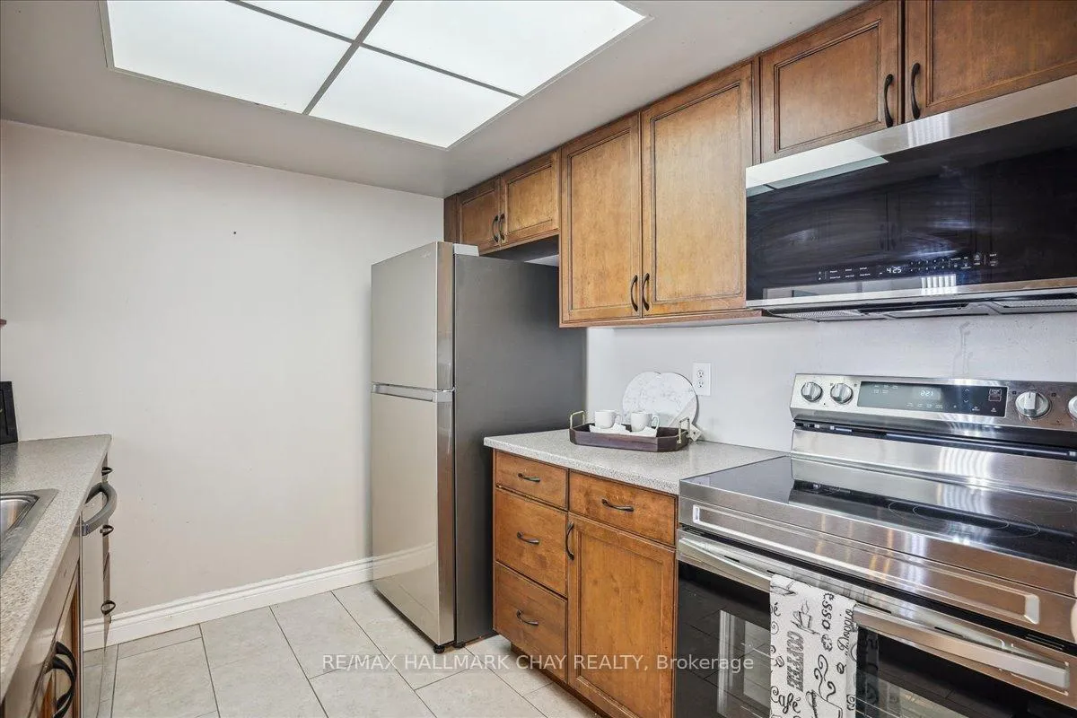 Photo 9 of Unit 809, 65 Ellen Street, Barrie, Lakeshore — HOMEH