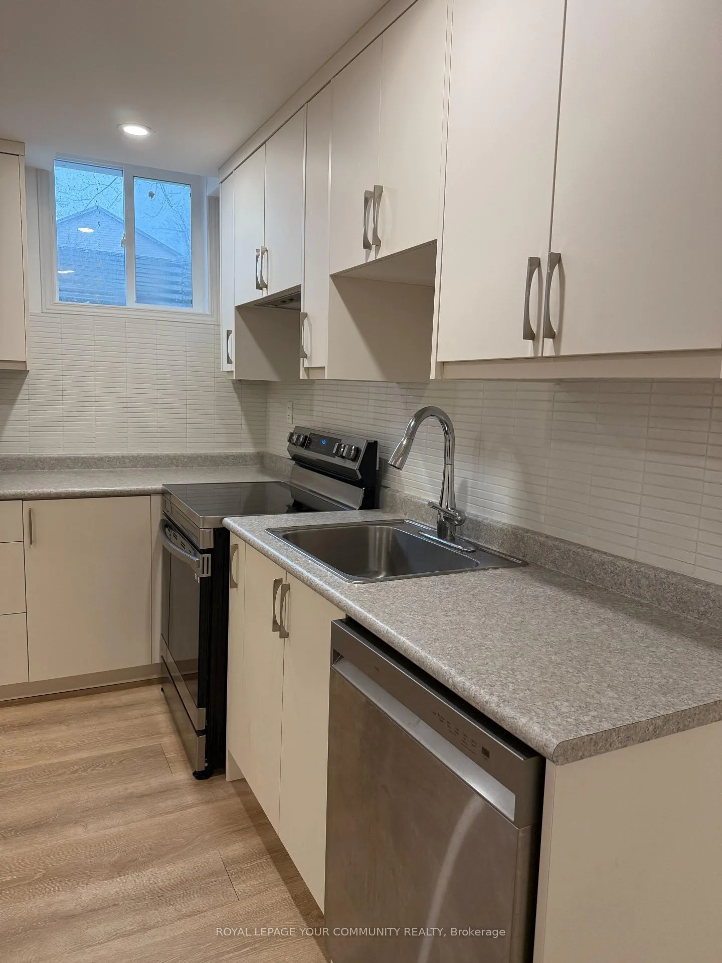 Photo 4 of Unit bsmnt, 87 Tamarac Trail, Aurora, Aurora Highlands — HOMEH