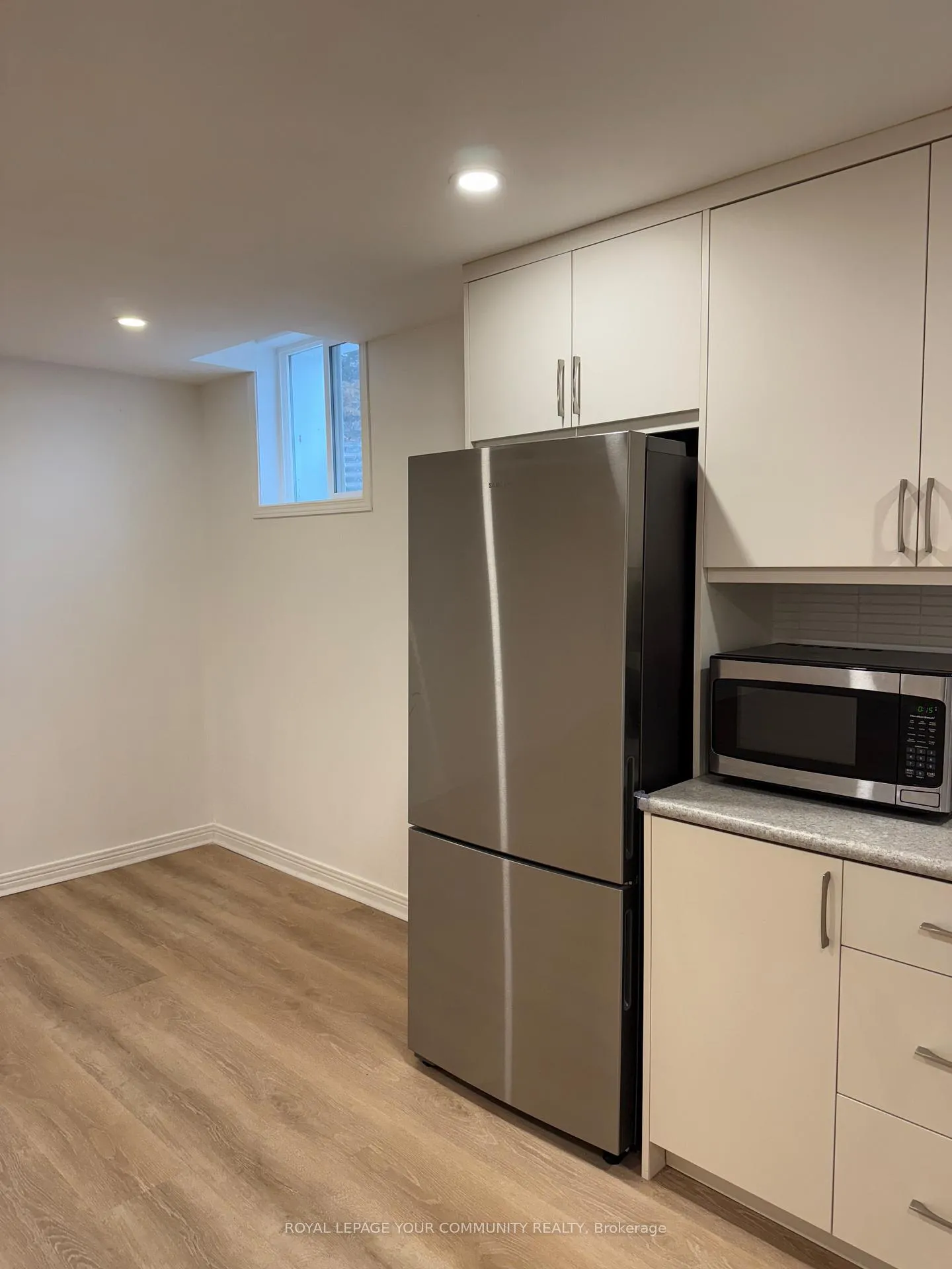 Photo 5 of Unit bsmnt, 87 Tamarac Trail, Aurora, Aurora Highlands — HOMEH