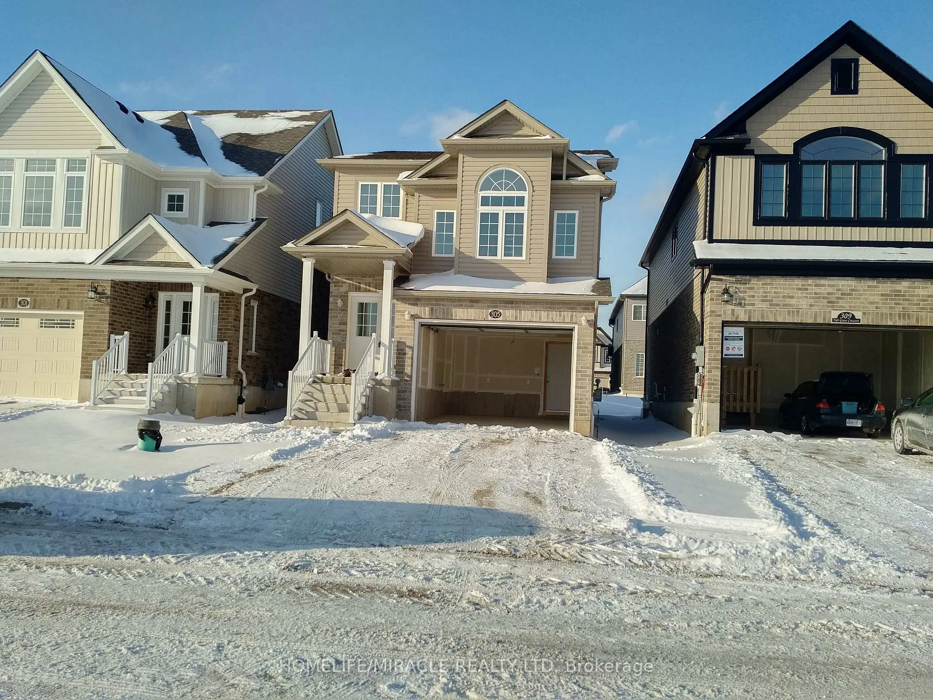 Front of 305 Tall Grass Crescent