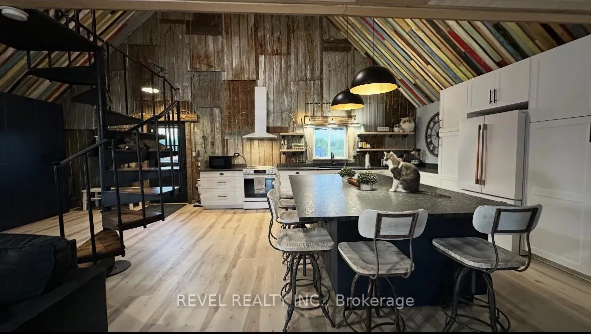 Photo 8 of 680 Peltola Road, Cochrane — HOMEH