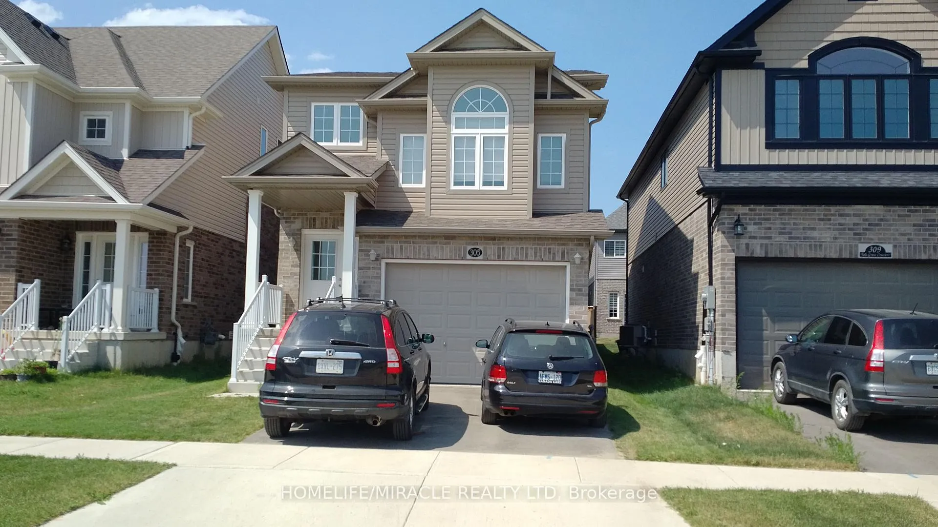 Front of 305 Tall Grass Crescent