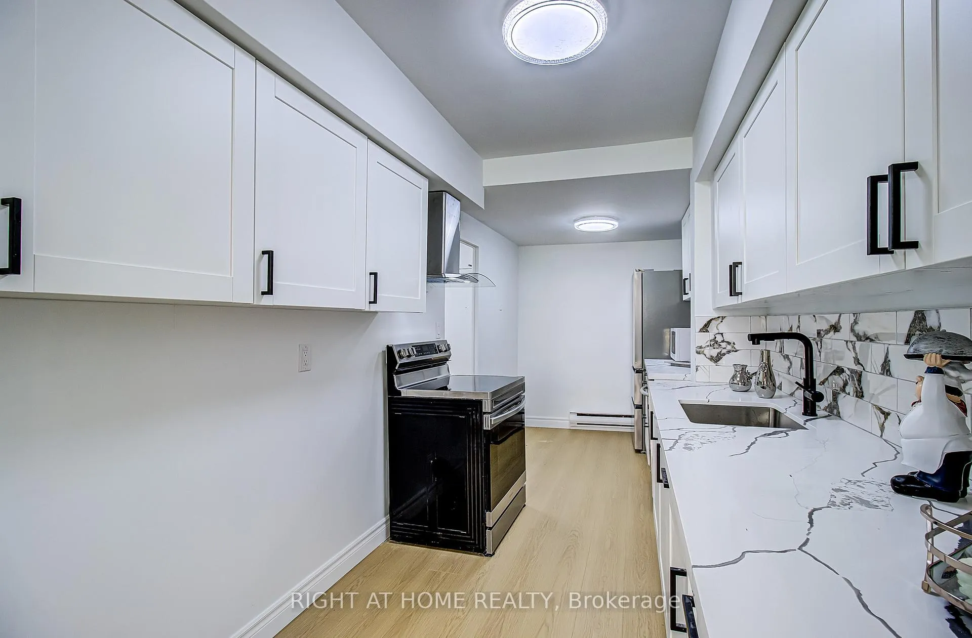 Photo 5 of Unit 409, 8 Crescent Town Road, Toronto, Crescent Town — HOMEH
