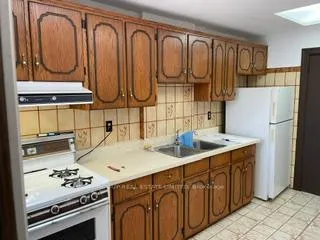 Photo 3 of Unit 1, 213 Silverthorn Avenue, Toronto, Weston-Pellam Park — HOMEH