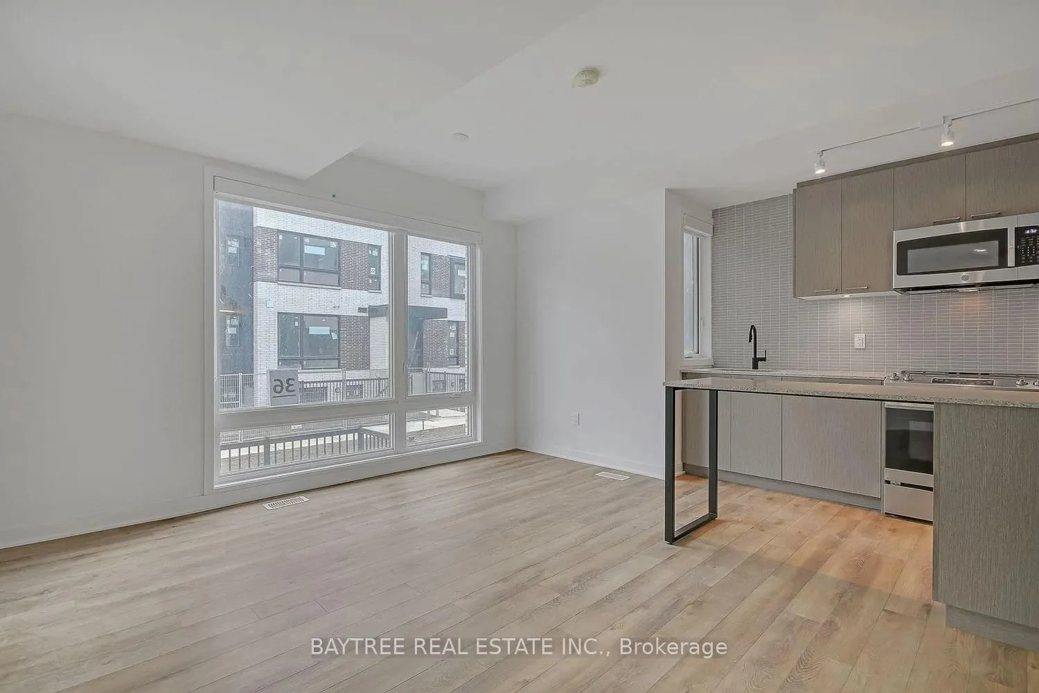 Photo 4 of Unit TH4, 30 Ed Clark Gardens, Toronto, Weston-Pellam Park — HOMEH