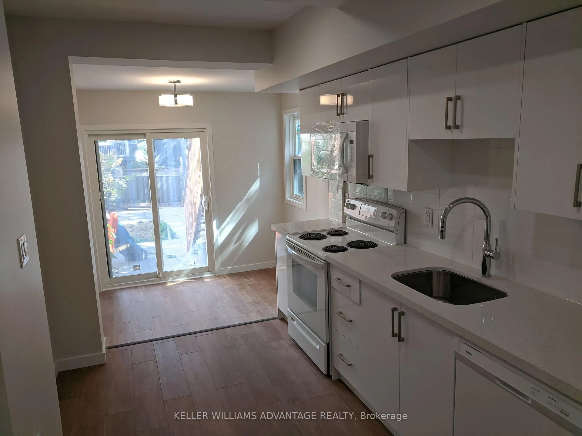 Photo 1 of Unit Lower, 119 Coxwell Avenue, Toronto, Woodbine Corridor — HOMEH