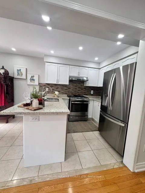 Photo 3 of 65 Bellchase Trail, Brampton, Bram East — HOMEH