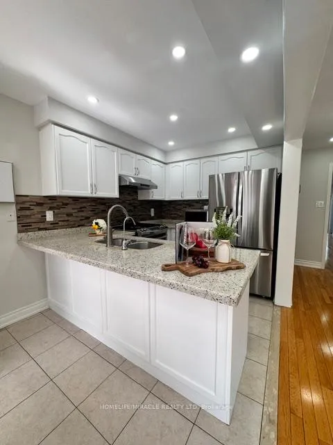 Photo 5 of 65 Bellchase Trail, Brampton, Bram East — HOMEH