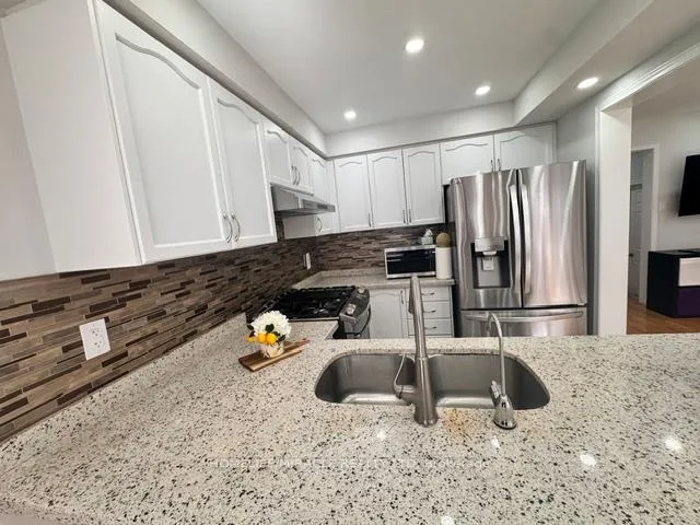 Photo 6 of 65 Bellchase Trail, Brampton, Bram East — HOMEH