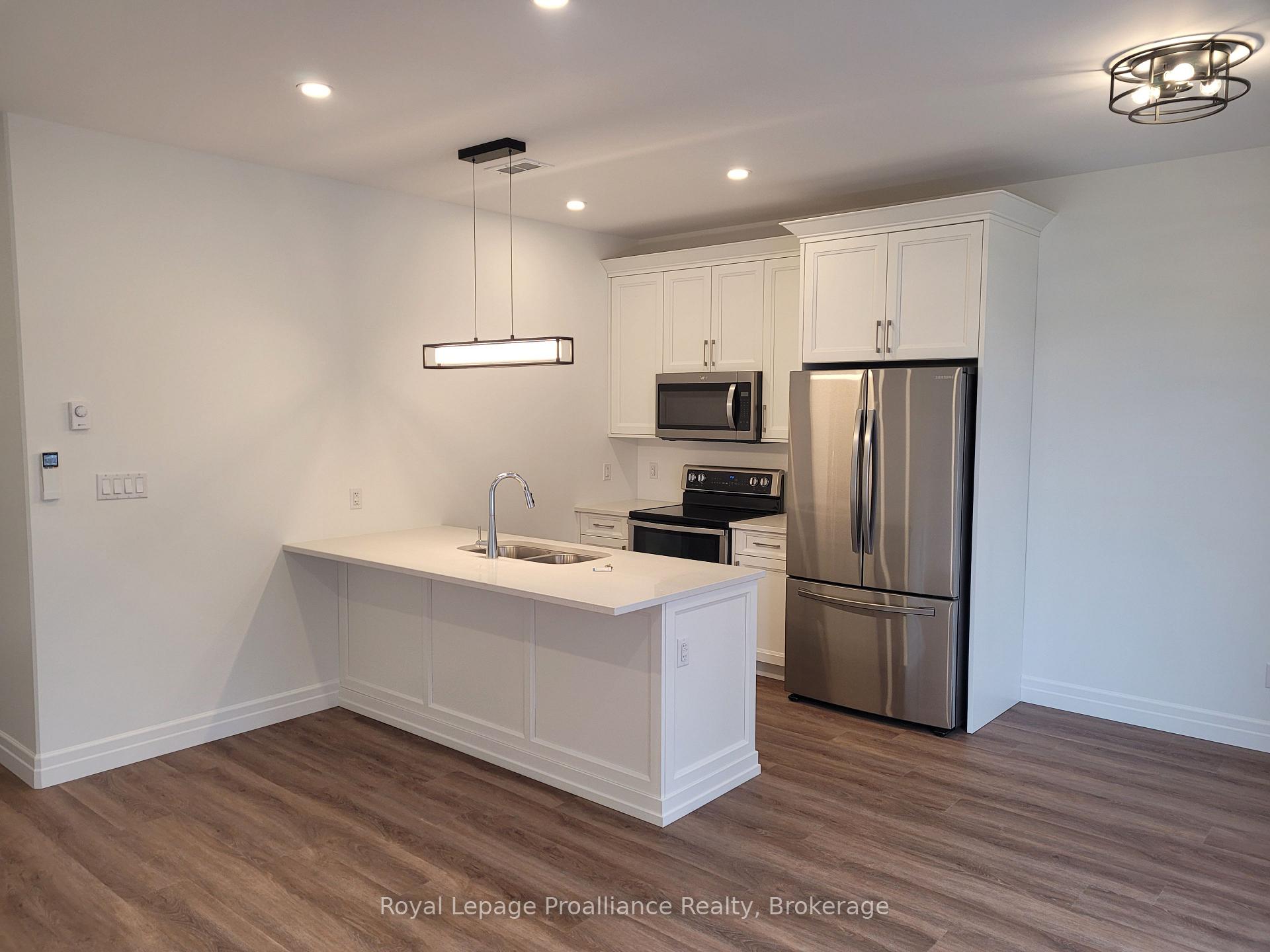 Photo 2 of Unit 4, 15 Bay Street, Quinte West, Trenton Ward — HOMEH