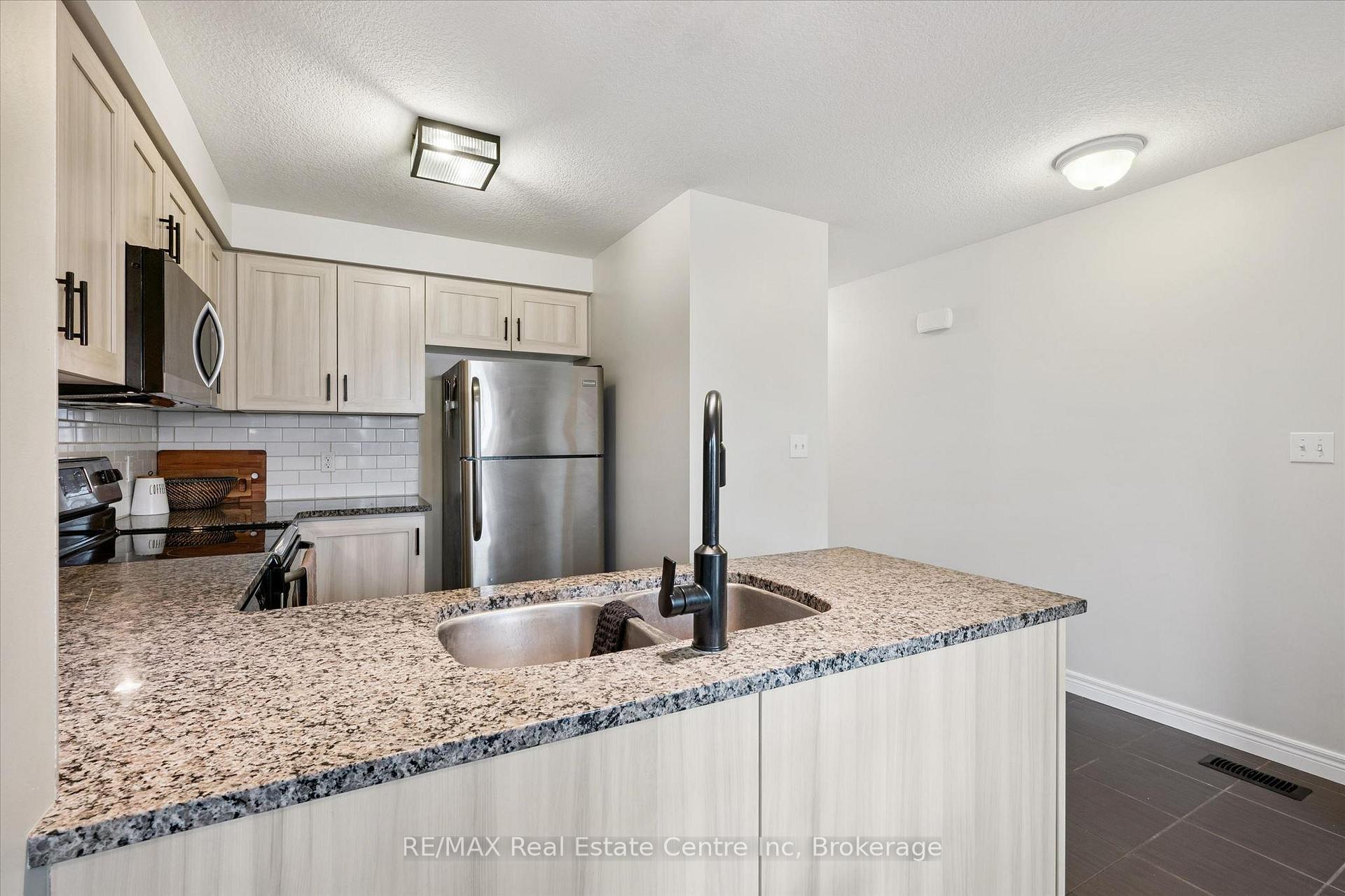 Photo 3 of Unit A, 634 Woodlawn Road, Guelph, Victoria North — HOMEH