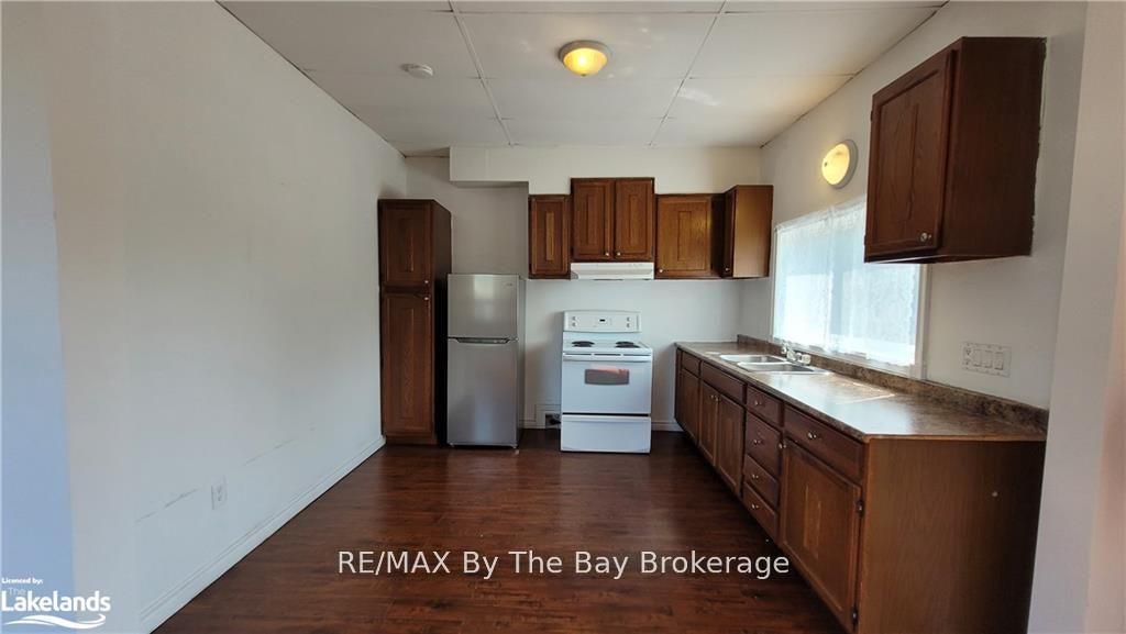 Photo 5 of Unit C01, 280 River Road E, Wasaga Beach — HOMEH