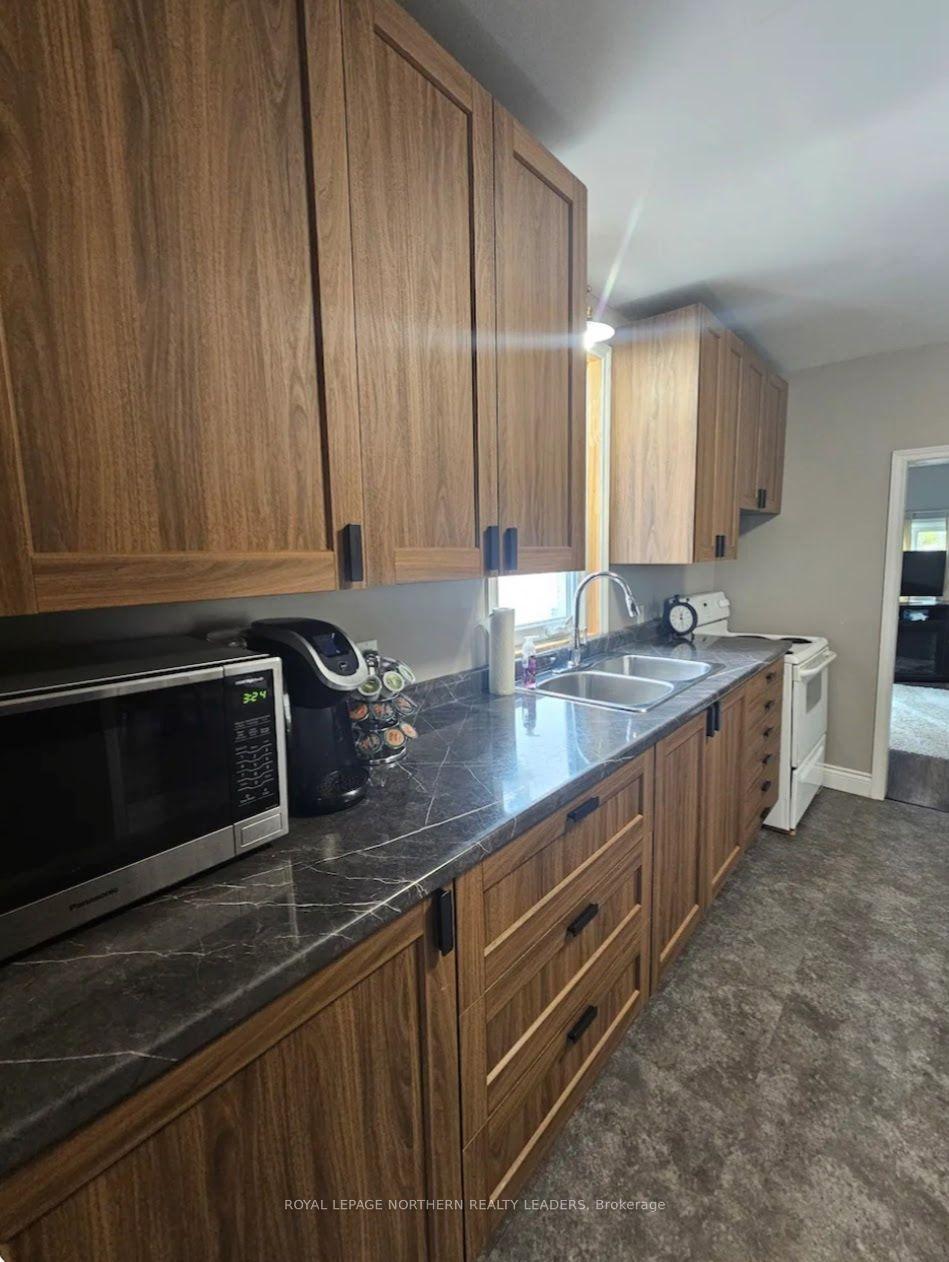 Photo 10 of 104 Fourth Avenue, Timmins, SCH - Main Area — HOMEH