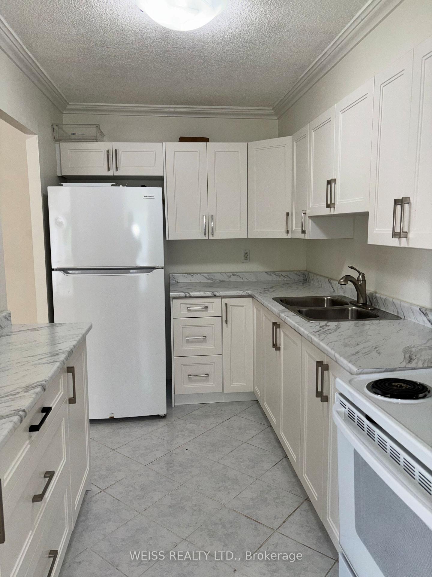 Photo 3 of Unit 310, 1801 O'Connor Drive, North York, Victoria Village — HOMEH