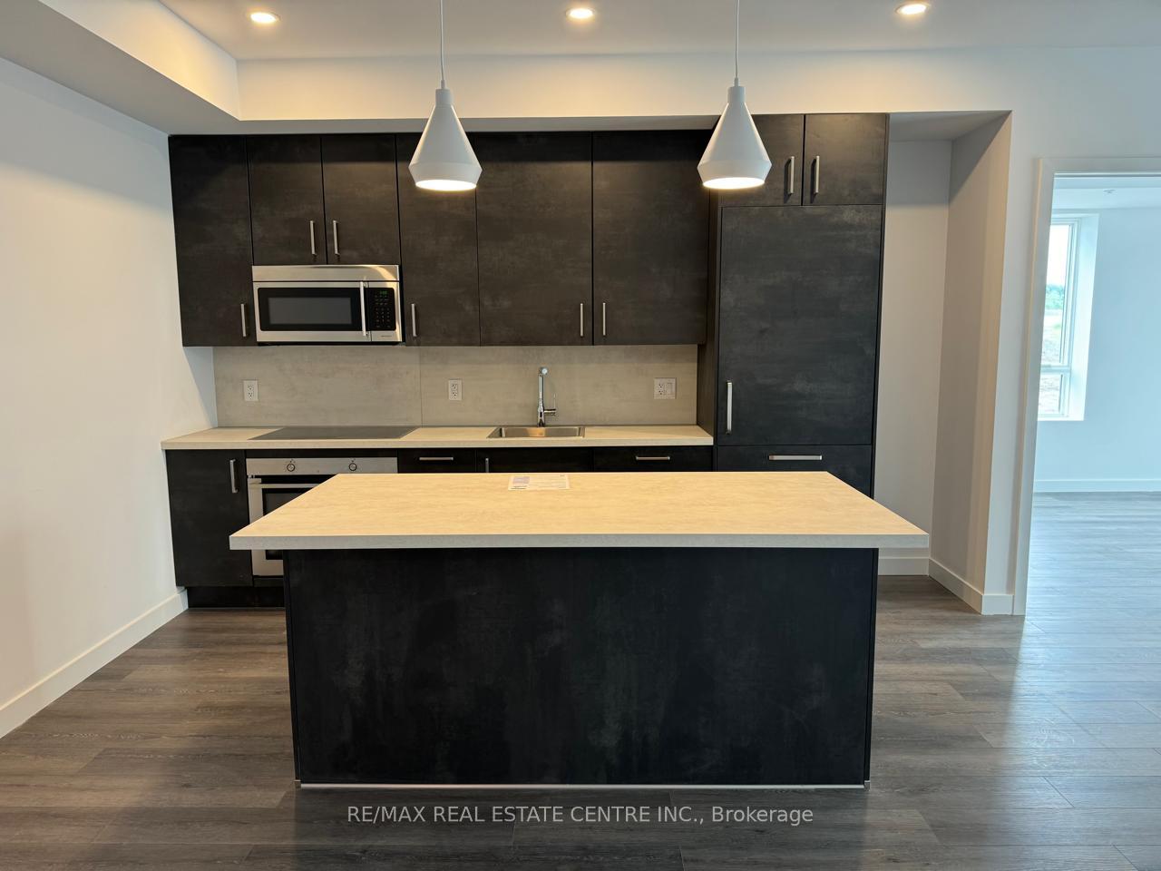 Photo 6 of Unit 110, 7549 Kalar Road, Niagara Falls, Brown — HOMEH