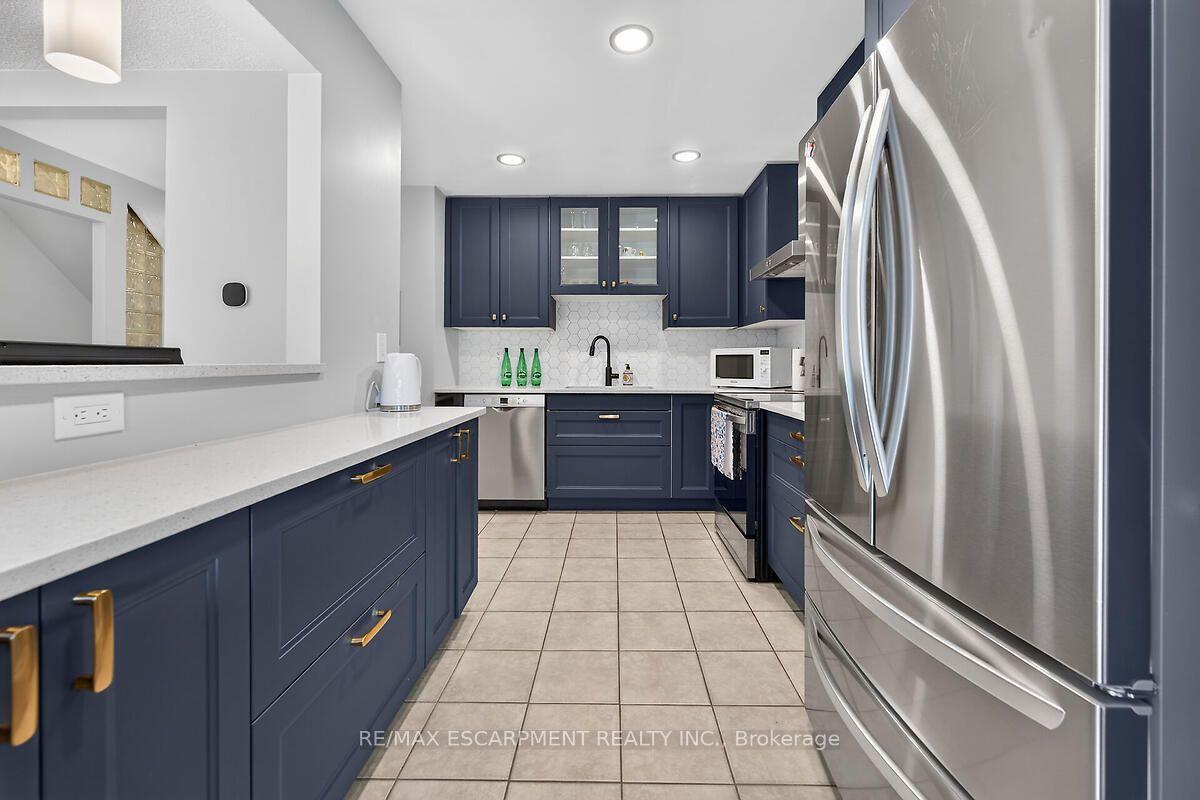 Photo 15 of Unit 24, 300 Rexford Drive, Hamilton, Randall — HOMEH