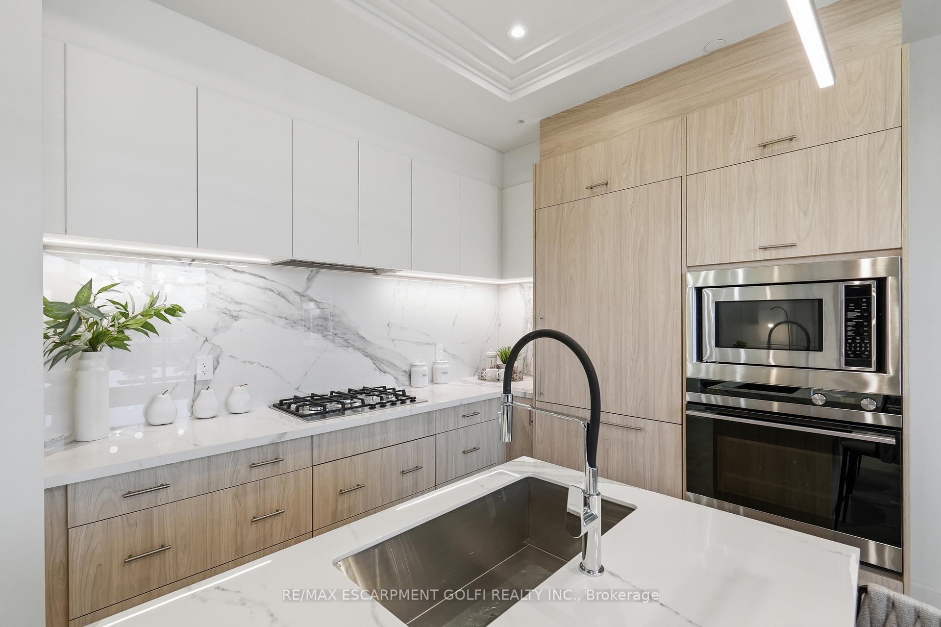 Photo 10 of Unit 409, 123 Maurice Drive, Oakville, Central — HOMEH