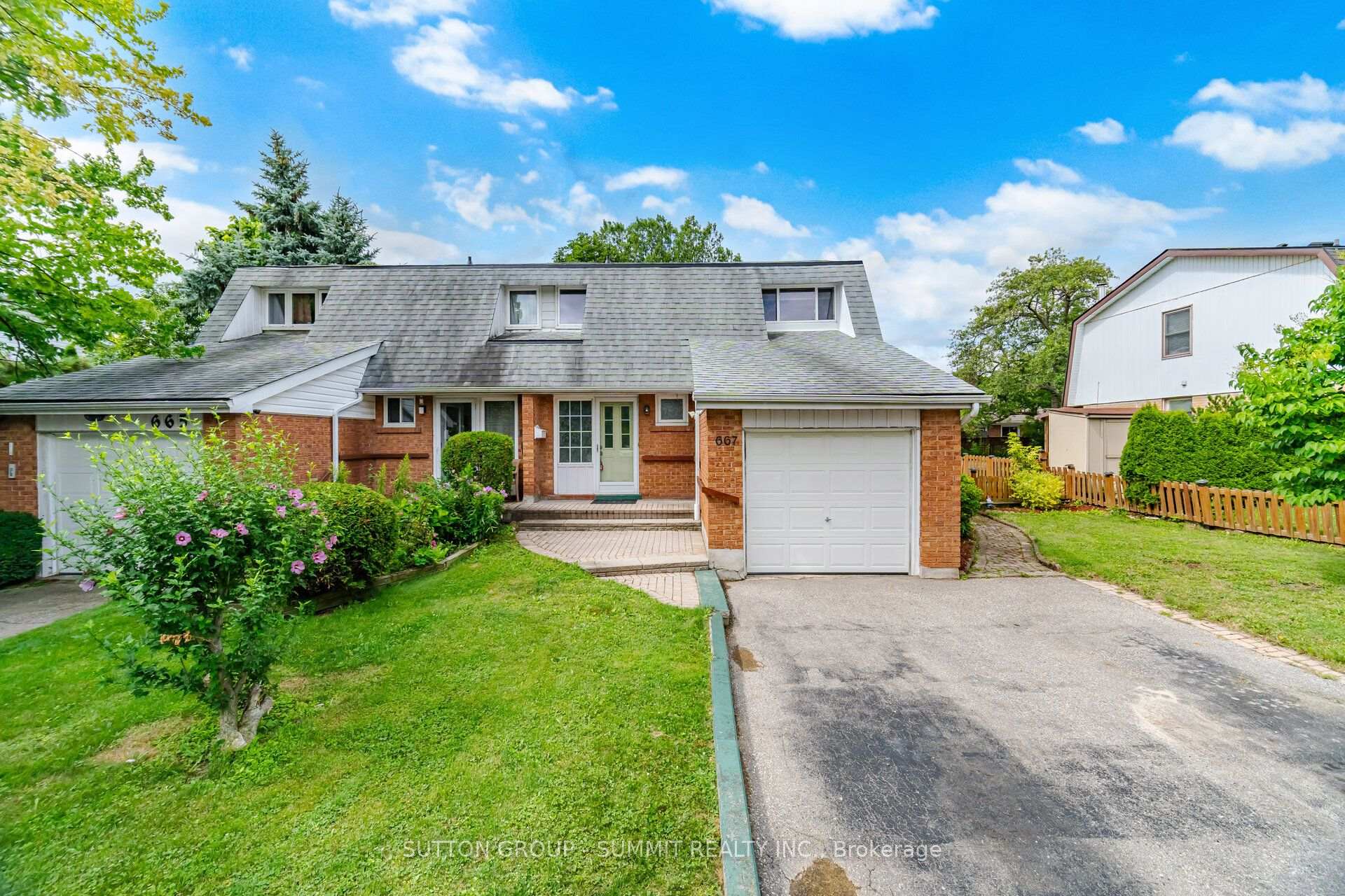 Front of 667 Green Meadow Crescent