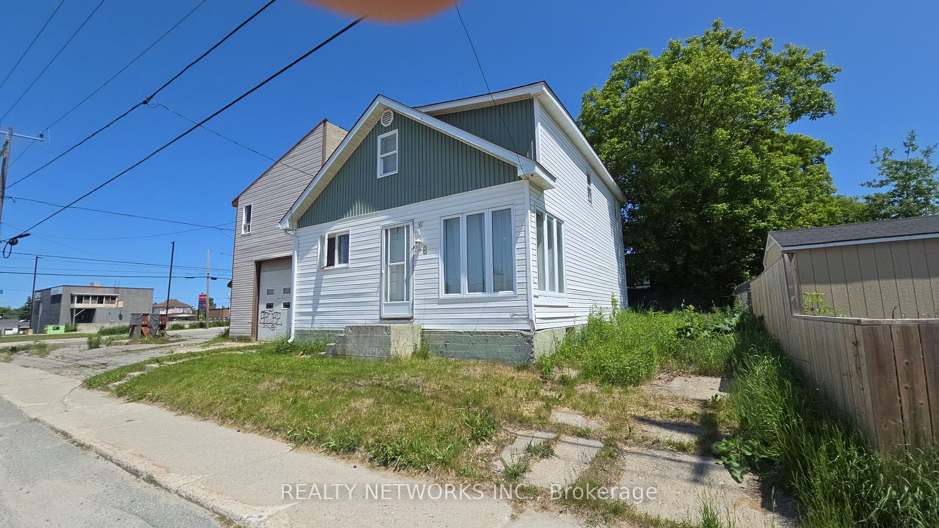 Photo 2 of 48 Cameron Street S, Timmins, TS - SW — HOMEH