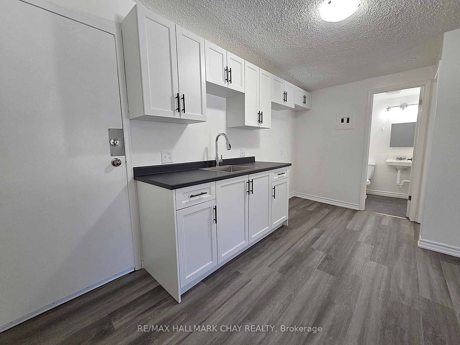Photo 4 of Unit 4, 58 Queen Street W, Springwater, Elmvale — HOMEH