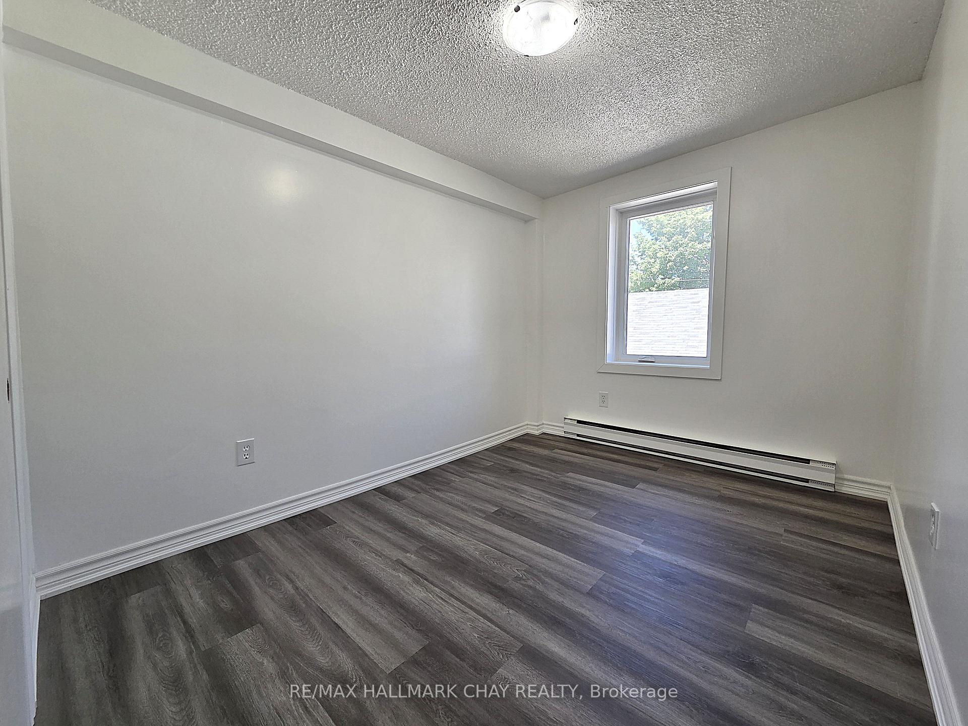 Photo 6 of Unit 4, 58 Queen Street W, Springwater, Elmvale — HOMEH