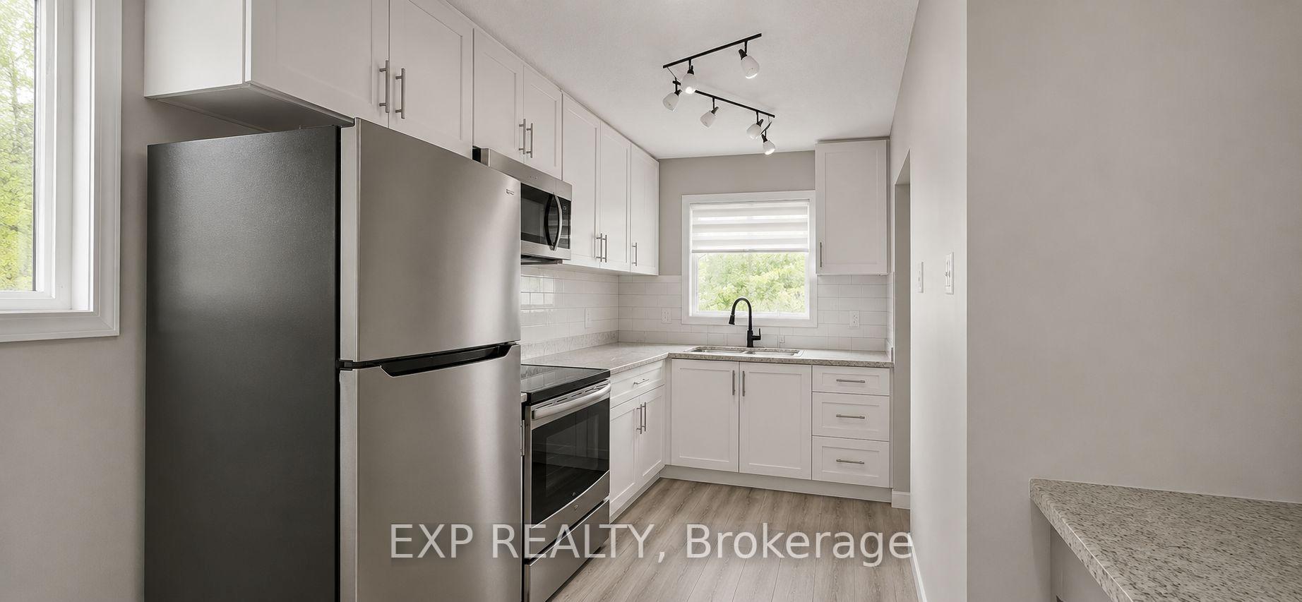 Photo 2 of Unit Main Level, 87 Wellington Street E, Brampton, Downtown Brampton — HOMEH