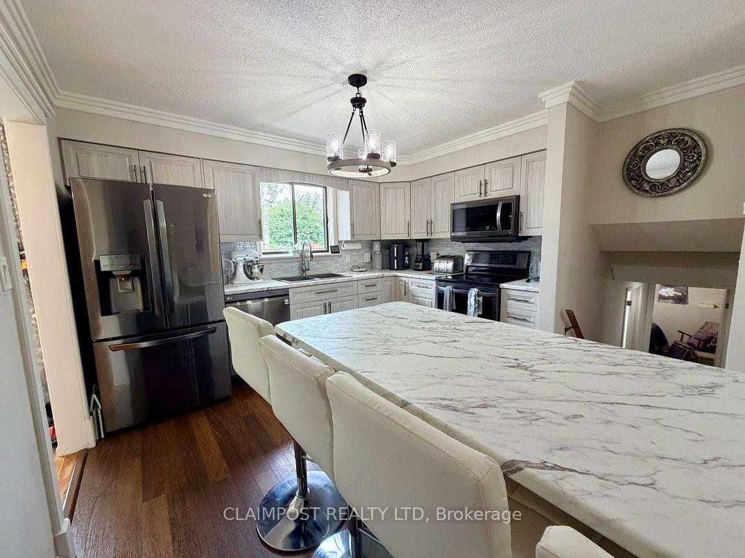 Photo 13 of 33 Algonquin Road, Cochrane — HOMEH
