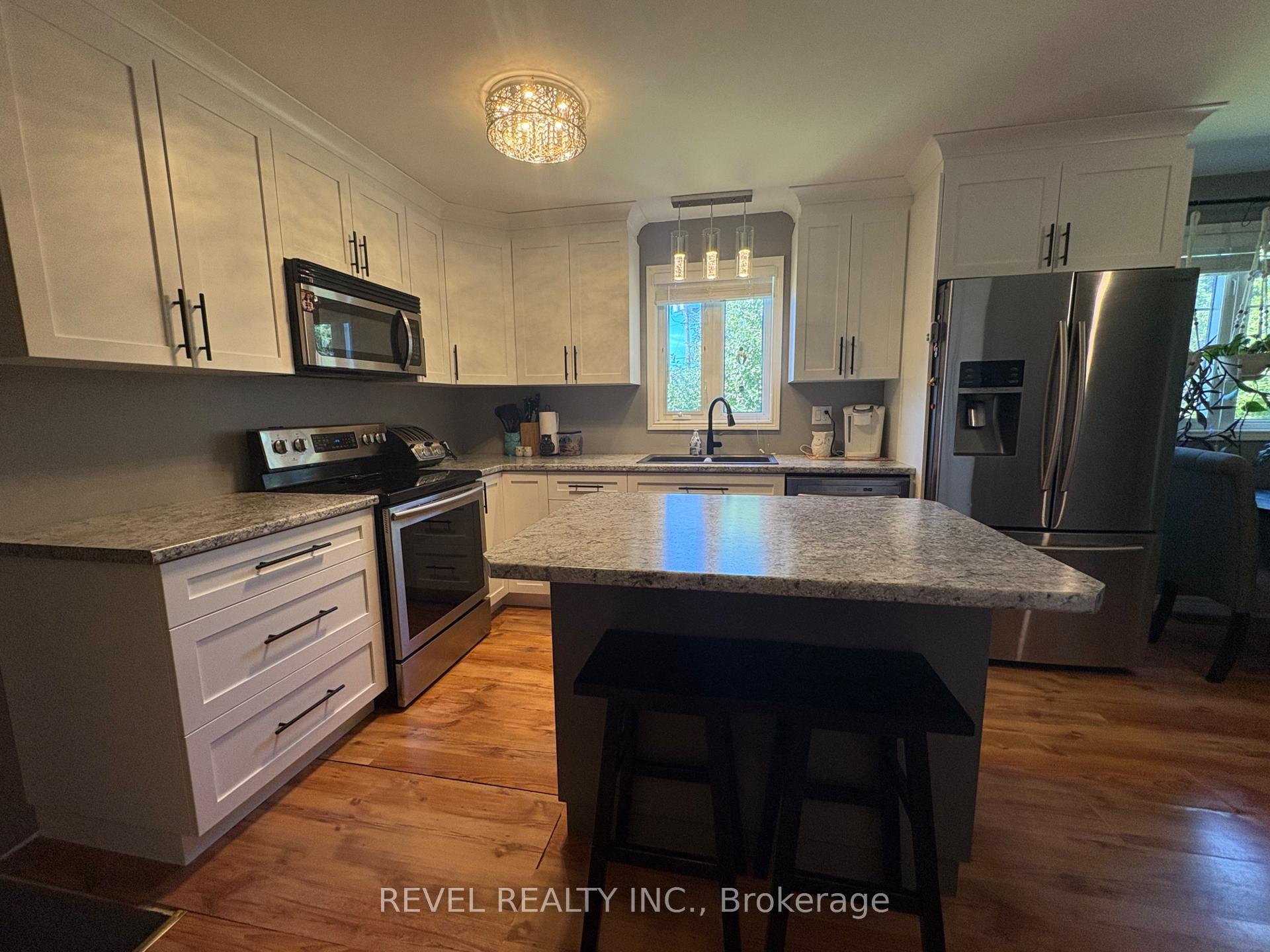 Photo 4 of 364 Genier Road, Cochrane — HOMEH