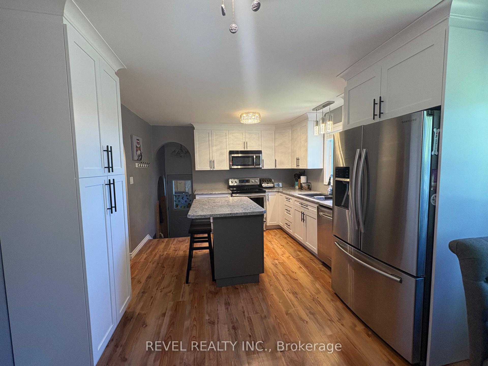 Photo 7 of 364 Genier Road, Cochrane — HOMEH