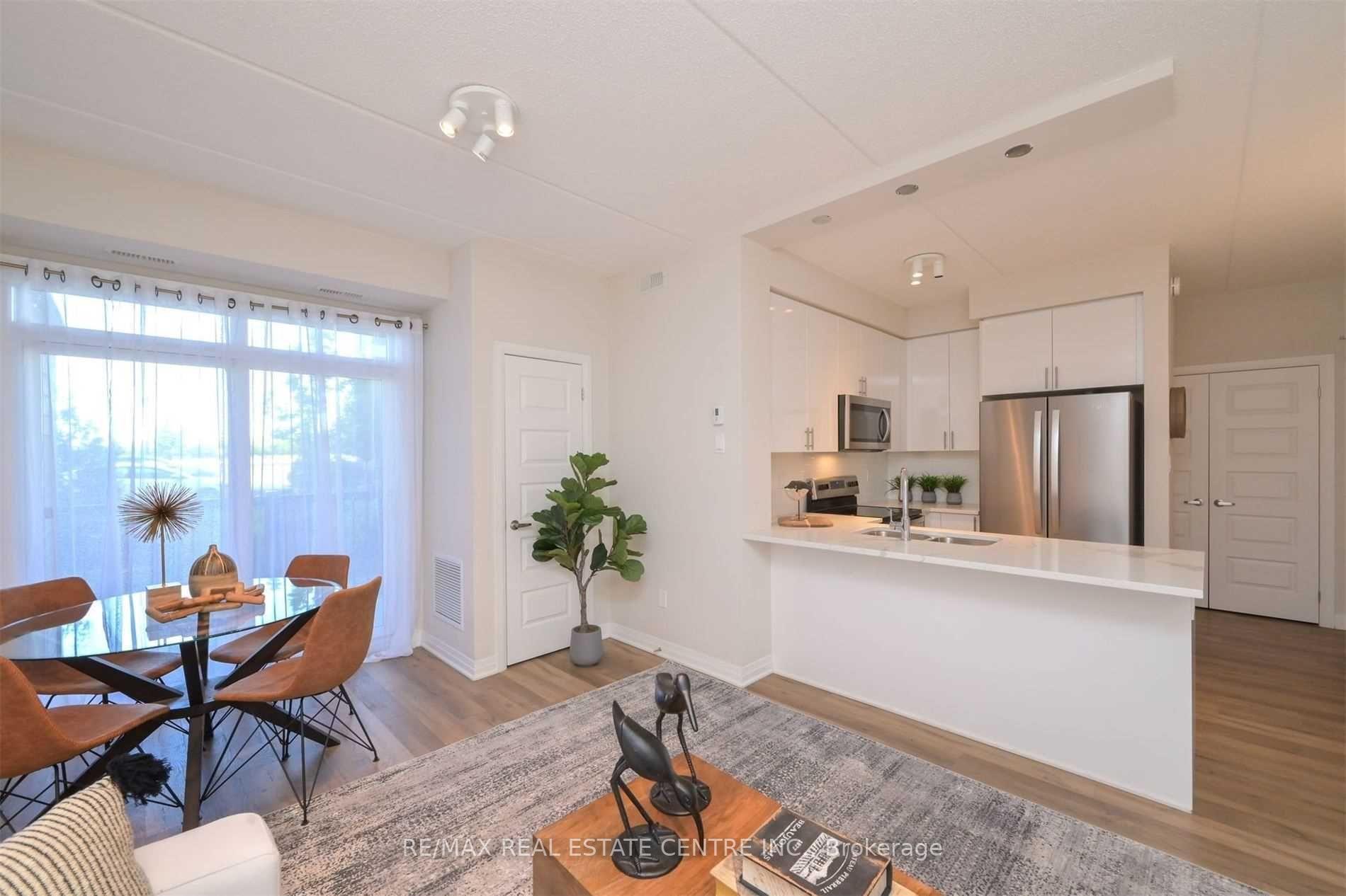 Photo 1 of Unit 102, 610 Farmstead Drive, Milton, Willmott — HOMEH