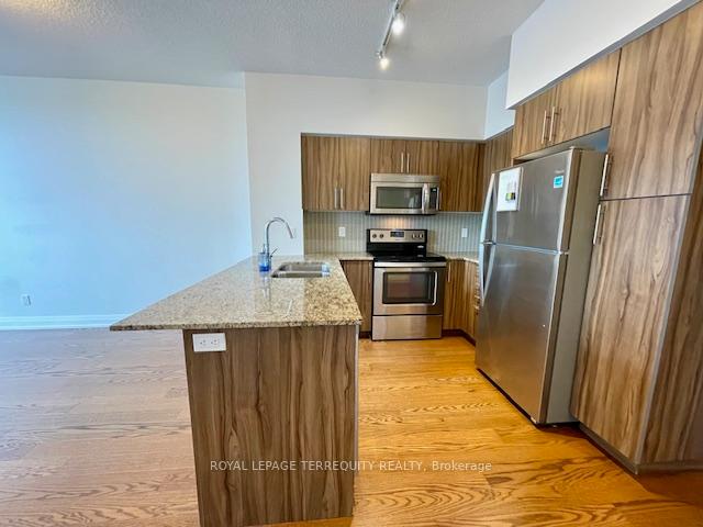 Photo 7 of Unit 323, 65 Speers Road, Oakville, Central — HOMEH