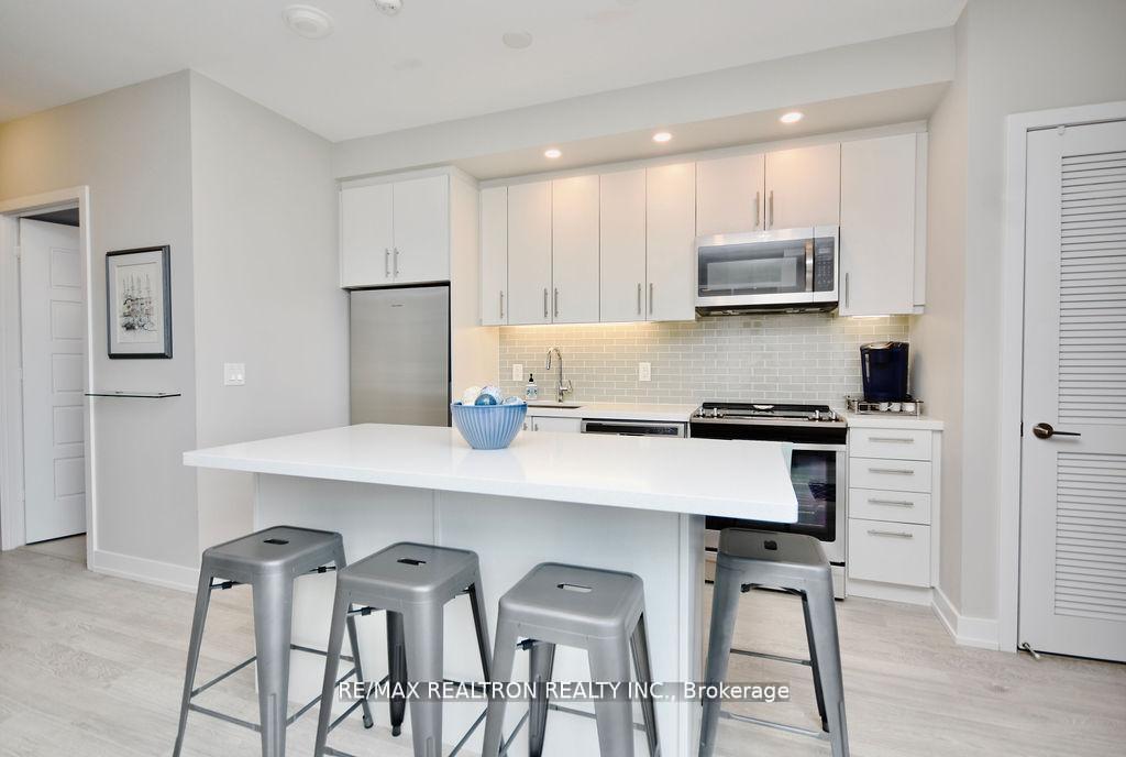 Photo 25 of Unit C404, 301 Sea Ray Avenue, Innisfil, Rural Innisfil — HOMEH