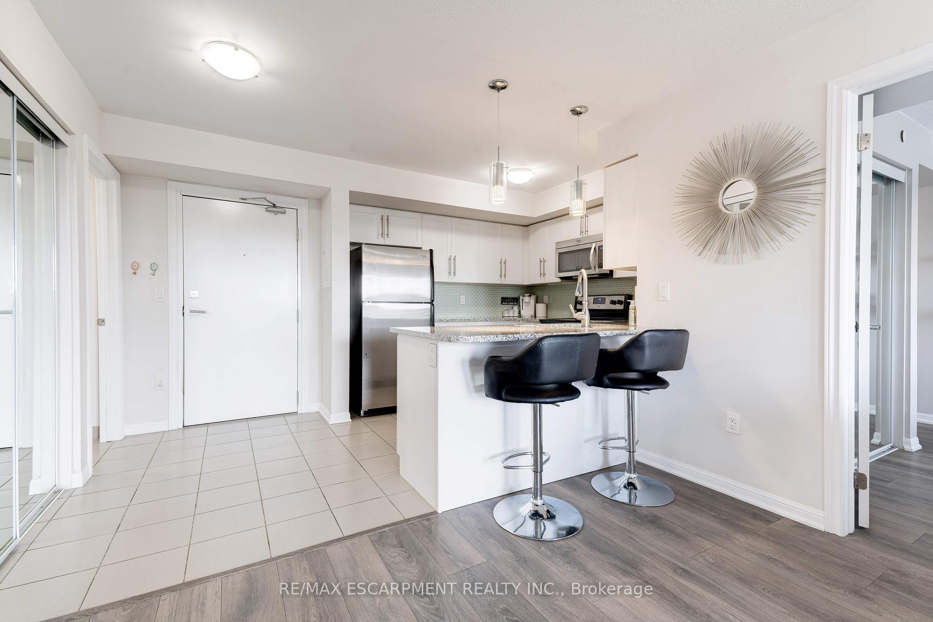 Photo 3 of Unit 406, 1045 Nadalin Heights, Milton, Willmott — HOMEH