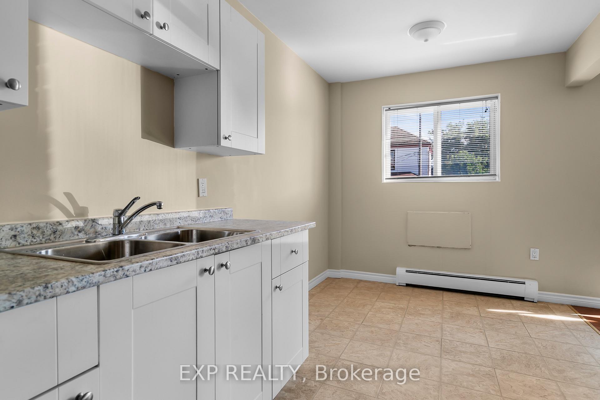 Photo 3 of Unit 5, 4663 Huron Street, Niagara Falls, Downtown — HOMEH