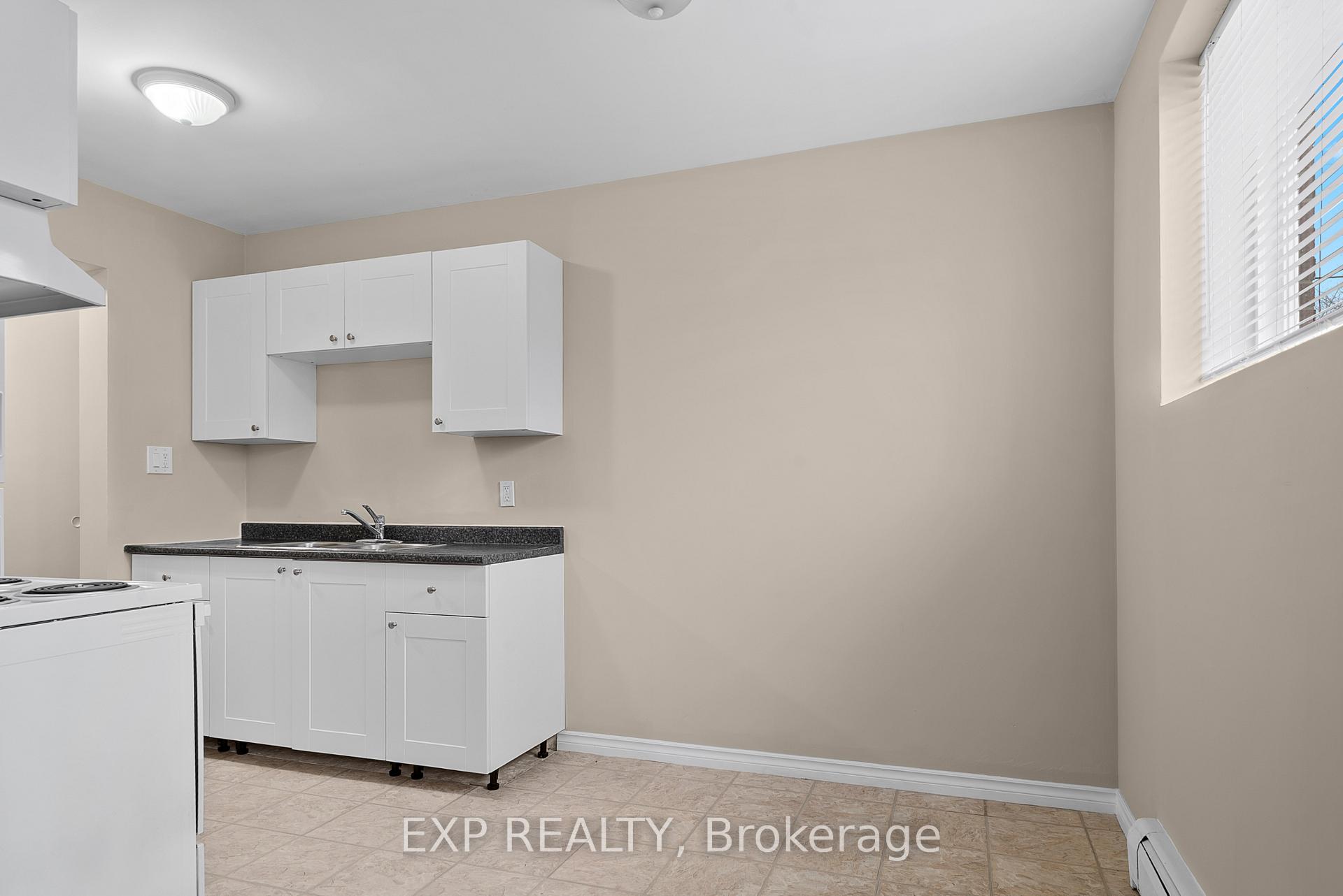 Photo 3 of Unit 1, 4663 Huron Street, Niagara Falls, Downtown — HOMEH