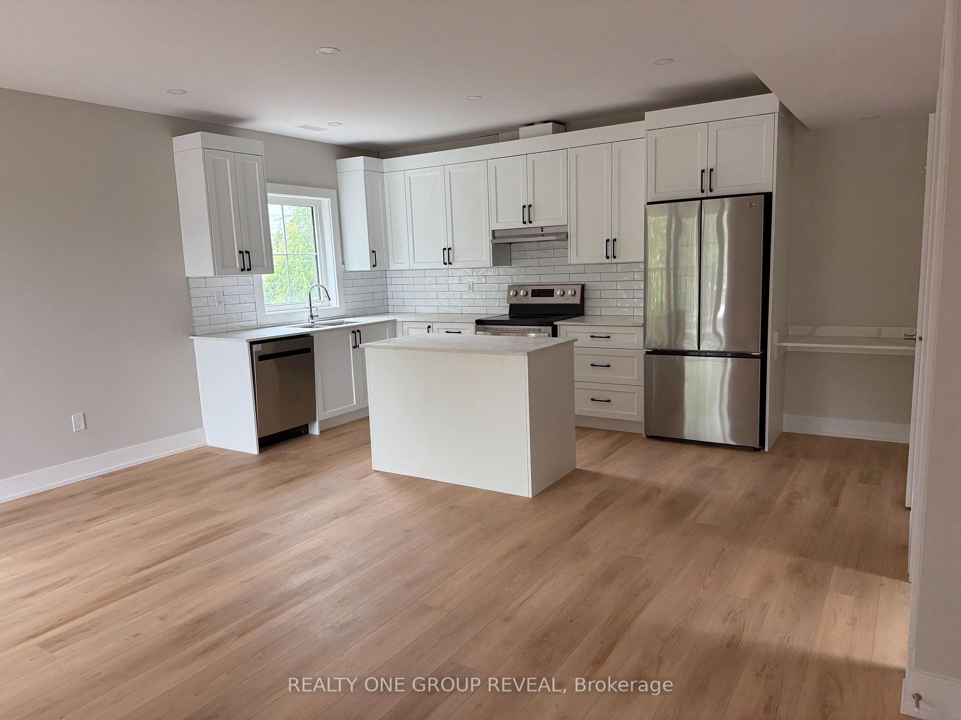 Photo 3 of Unit 2, 24 Queen Street, Clarington, Bowmanville — HOMEH