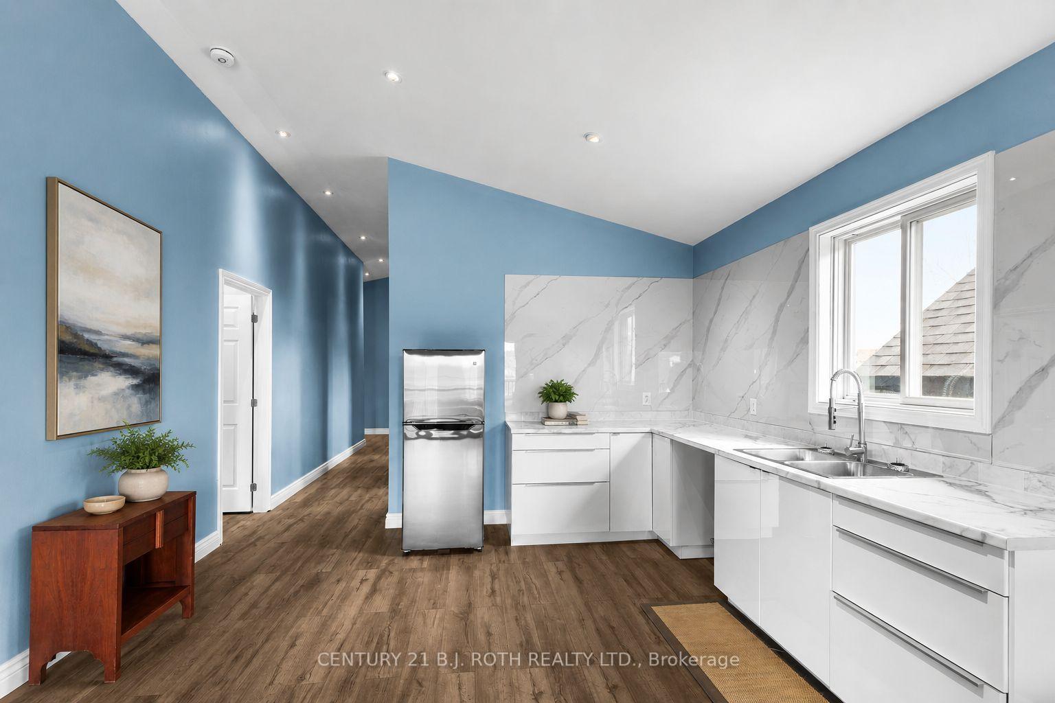 Photo 3 of 102 Dunlop Street, Orillia — HOMEH