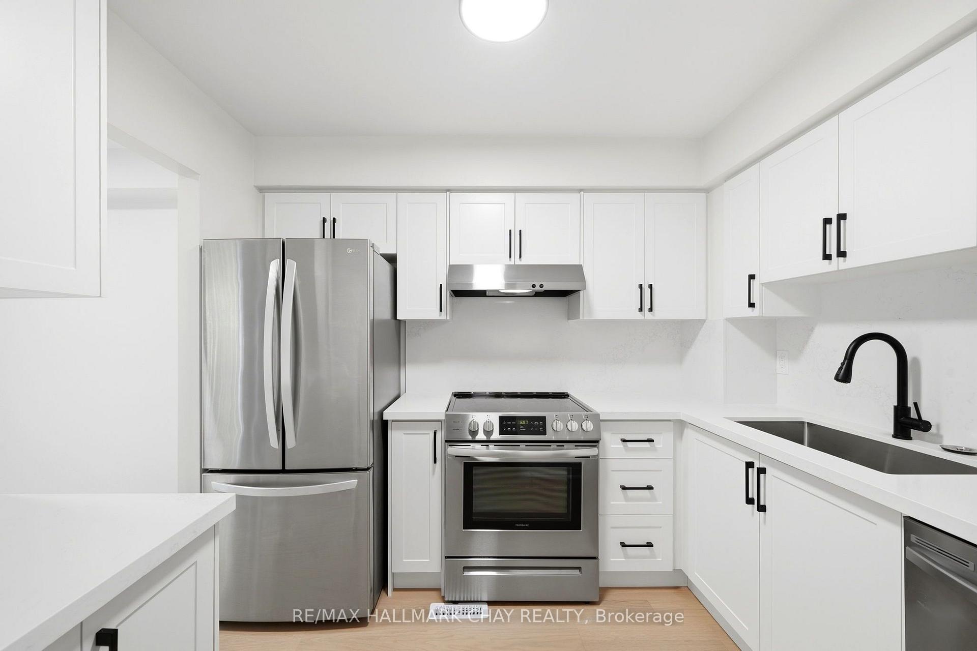 Photo 6 of Unit 6, 52 Adelaide Street, Barrie, Allandale — HOMEH