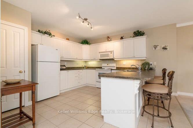 Photo 9 of Unit 309, 1998 Ironstone Drive NE, Burlington, Uptown — HOMEH